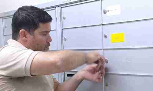 Silver State Locksmith technician rekeying a bank of mailbox locks