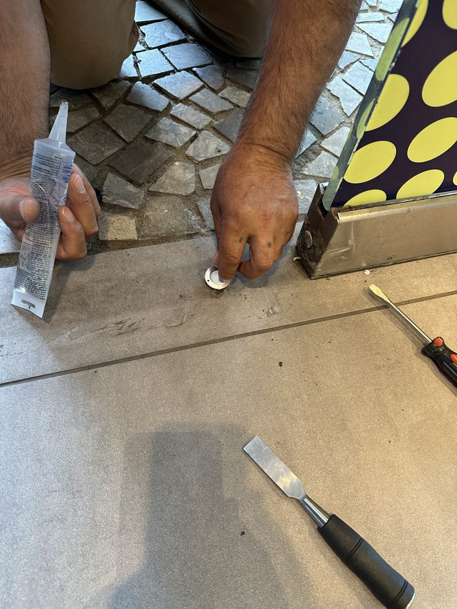 Rebuilding a floor lock socket at a storefront entrance